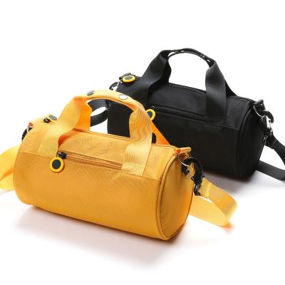 China Solid Color OEM Fancy Barrel Mini Shoulder Gym Bag Weekend Duffle Sports Travel Waterproof Black Yellow Round Bag With Logo Customized for sale