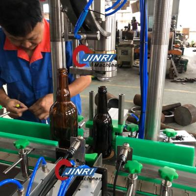 China Beverage Glass Bottle Automatic Single Head Crown Capping Machine for sale