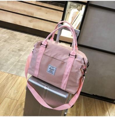 China Fashion Large Capacity Folding Travel Luggage Lady Bags Sport Pink Travel Duffel Bag for sale