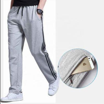 China Anti-wrinkle sports pants men's autumn and winter plus size velvet loose straight three big - helm men's elastic pants for sale