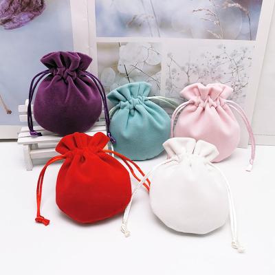 China Custom Morden Style Mini Drawstring Circle Jewelry Pouch Velvet Suede Round Jewelry Pouch New for sale