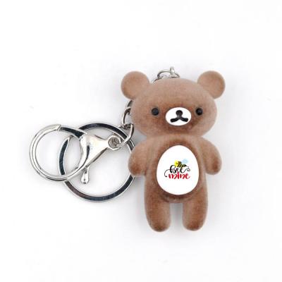 China Lovely Neoprene Brown Bear Key Chain Plastic Custom Flocking Teddy Bear Doll Plush Keychain Personalized Key Chain for sale