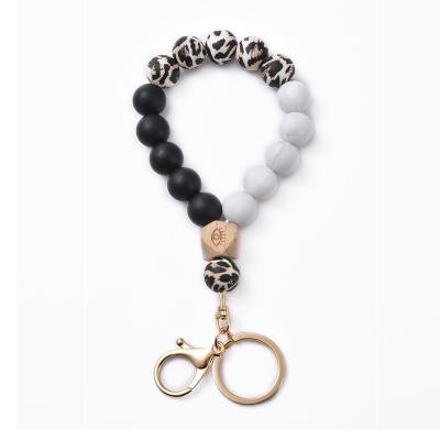 China Anti-lost Leopard Print Personality Fashion Edible Silicon Beads Bracelet Alloy Keychains for sale