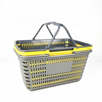 China Manufacturer Wholesale Portable 28L Fruit Vegetable Storage Durable Plastic Basket with Handles for sale