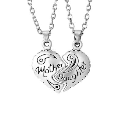 China Wholesale Ethnic Jewelry Mother's Day Matching Heart Puzzle Pendant Necklace for Women and Daughter Split Heart Puzzle Necklace for sale