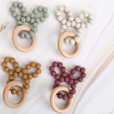 China Silicone Ring Teether Beech Little Baby Teethers Performance Wooden Grinding Toy for sale