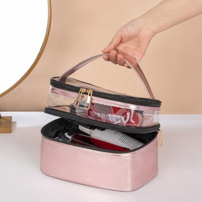 China Fashionable Custom Portable Leather Makeup Bag Cosmetic Travel Waterproof Large Capacity Double Layer Clear Plastic Toiletry Bag For Women for sale