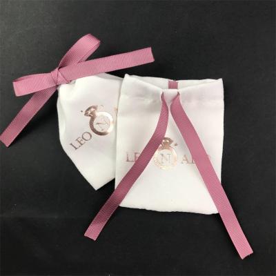 China Multifunctional jewelry bag white velvet pouch with pink grosgrain ribbon tie cord with custom logo in gold pouch bag for sale