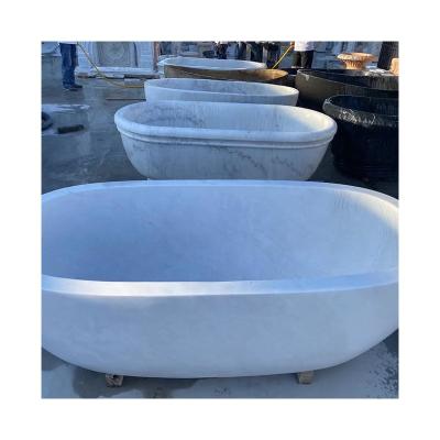 China Freestanding Most Popular Customized Colors Natural Stone Soaking Marble Bathtub Freestanding With Armrests for sale