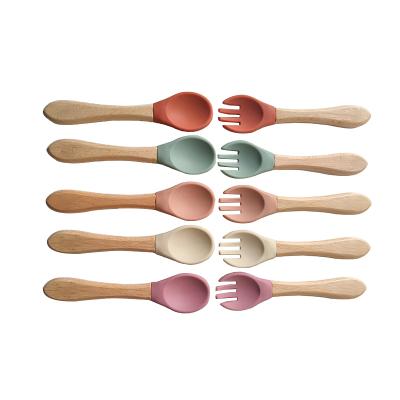 China BPA Free Baby Feeding Ensures Food Grade Silicon Gel Wood Bebe Toddler Silicone Wooden Set Spoon and Fork for sale