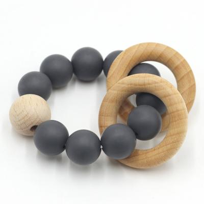 China Soft Toy Silicone Teether Beads Customized Wooden Baby Teether Ring Silicone Teether Rattle Baby Gift Set for sale