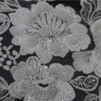 China 2021 Factory direct sale viable embroidered lace up fabric white lace with pearl and sequins for sale