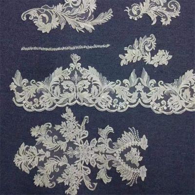 China Hot Product 2021 Bridal Mesh Lace Fabric Sequin Machine Embroidered Sustainable Stretching Lace Fabric for sale