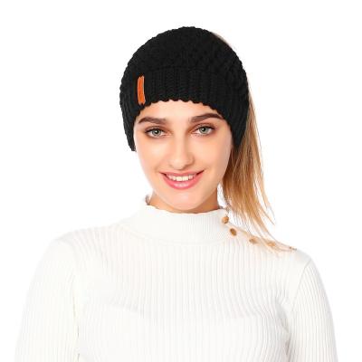 China COMMON PU Leather Logo Designed Women's Single Ponytail Hat Ear Protection Knitted Fashionable Winter Warm Hats for sale