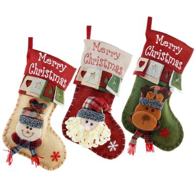 China Custom Large Popular Christmas Stockings Merry Christmas Gift Three-Dimensional Christmas Santa Snowman Decorative Gift Bag for sale