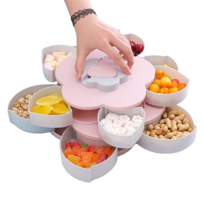 China Viable Wholesale Gift Creative Plastic Rotating Candy Tray Plate Petal Shaped Snack Storage Boxes for sale