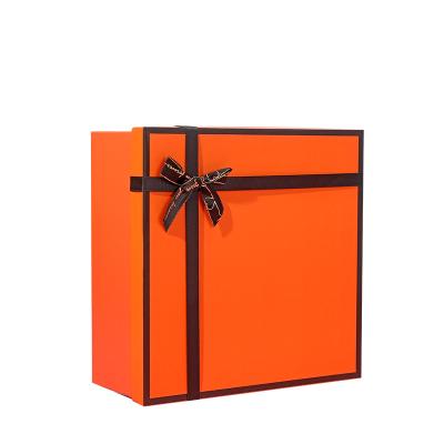 China Recycled Materials Factory Stain Box Cardboard Hardcover Book Bowknot Sky Cover High End Warm Orange Gift Box for sale