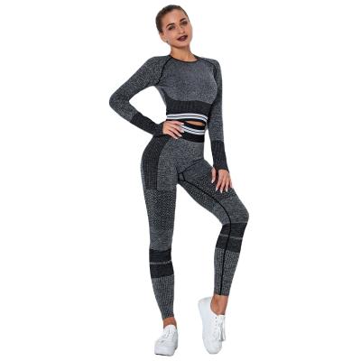 China The breathable two-piece pants butt crack! crack! black leggings set long sleeve thick hole yoga womens clothing pants seamless textured tops for sale