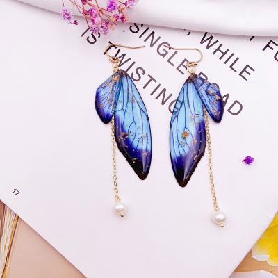 China FASHIONABLE fairy clear resin wings long pearl drop earrings freshwater butterfly women earring tassel drop earrings for sale