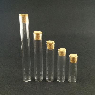 China Stocked Small Clear Glass Tube Bottle Jar With Cork Lid for sale