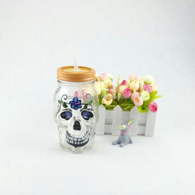 China 500ml Skulls Freshness Keeping Shape Clear Mason Jar And Metal Glass-Glass Lid With Straw for sale