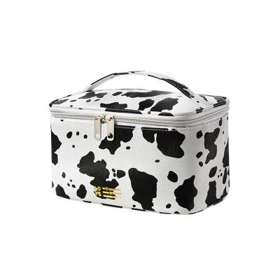 China Women's Waterproof Lady Cow Printing Toiletry Bag Travel Handheld Toiletry Bag for sale