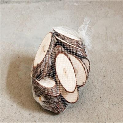 China China Slices Circles With Tree Bark Rustic Wooden Round Wooden Chopper Slice In Net Bag for sale