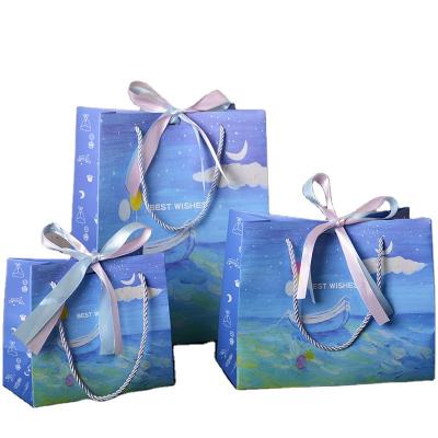 China JuYi Birthday Gift Bags Recyclable Custom Blue Ship And The Sea Candy Paper Bags With Ribbon Handle Children's Day For Kids Party Supplies for sale