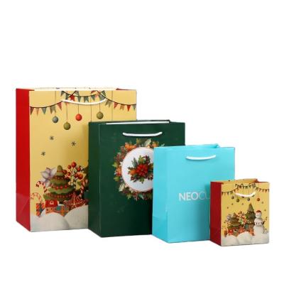 China JuYi Art Paper Business Christmas Recyclable Biodegradable Theme Kraft Paper Bag Shopping Wide Base With Your Own Logo for sale