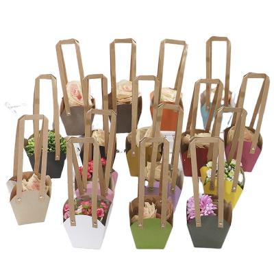 China JuYi Recyclable Custom Printed Wedding Luxury Flat Bottom Wide Bottom Bonsai Plants Flower Handle Paper 150g Kraft Paper Bag for sale