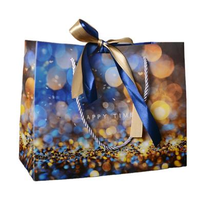 China Present Luxury Recyclable Custom Paper Packaging Candy Paper Gift Bag Garment Shopping Bag Gift Bag Sliver For Wedding Party for sale