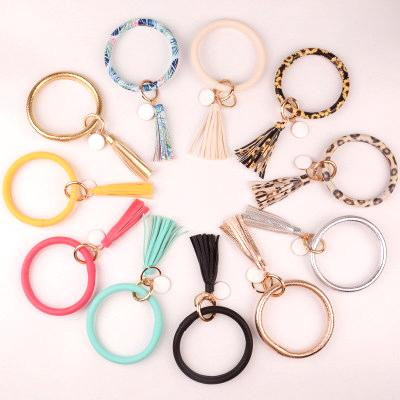 China Key Chain Bracelet Leaves Pattern Big Ring Key Ring Bracelet Rubber Tassel Silicone Key Chain Bracelet Leather for sale