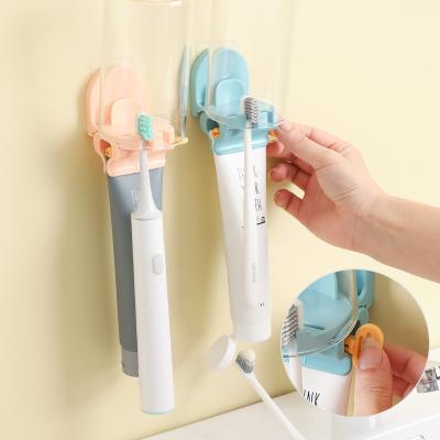 China Viable Vibrato Blast Automatic Toothpaste Dispenser Device Set Free Punch Toothbrush Holder Squeezing Toothpaste Toothbrush Holder for sale