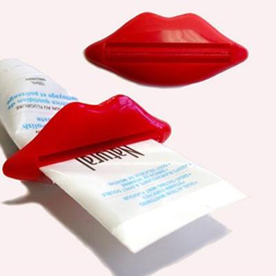 China Viable Cartoon Red Lips Shape Cosmetic Squeezer Multifunctional Toothpaste Squeezer Bathroom Supplies for sale