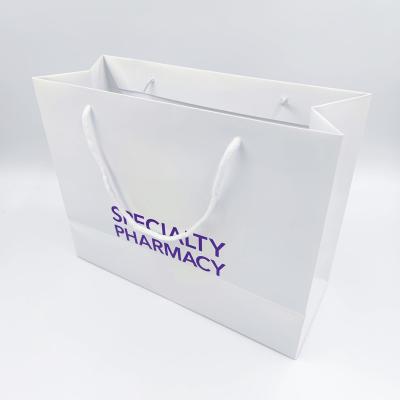 China Luxurious Custom Shopping Paper Bags With Your Own Logo	Paper Packing Bags à venda