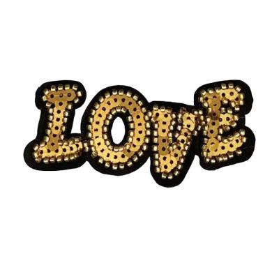 China 2021 New Alphabet Sequin Embroidery Patch Garment Decoration Embroidery Cloth Iron Gold Patch Customized Viable Design for sale