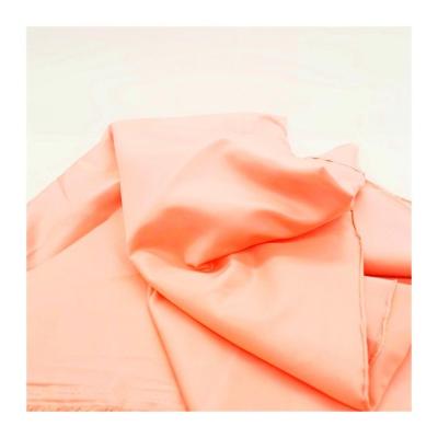 China Shrink-Resistant High Quality Elastic Smooth Orange 100% Polyester Imitated Silk Fabric for sale