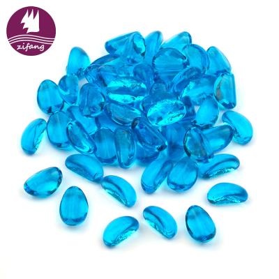 China Contemporary Wholesale Home Decor Fireplace Cashew Shape Colored Fire Pit Glass Beads for sale