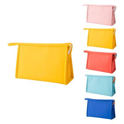 China Fashion Solid Color Towel Style Portable Cosmetic Bag Makeup Storage Bag PU Handheld Wash Bag for sale