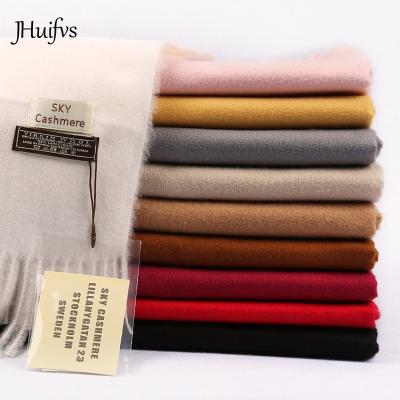 China New Fashion Hot Selling Polyester Pashmina Tassel Solid Cashmere Women Thicker Warm Covering Shawl Wraps Scarves for sale