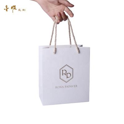 China Full Embossing Eco - Friendly Paper Cardboard Material Eco - Friendly Hot Stamping Luxury Paper Bags For Gift Packaging for sale