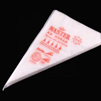 China Hot Selling Disposable Kitchen Accessories 100 Pcs Cake Icing Bag Flower Decoration Tools Triangle Flower Bags for sale