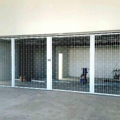 China Puertas de parrilla de acero inoxidable Puertas corredizas automáticas motorizadas en venta