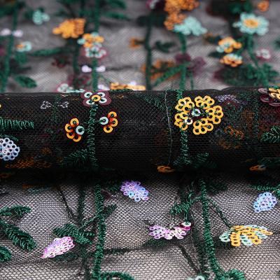 China Viable in stock pattern multicolor glitter sequin net flower vine embroidery fabric for sale