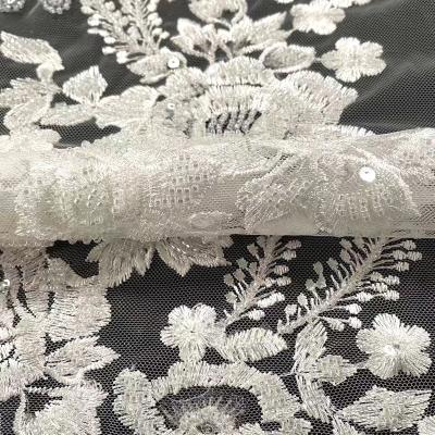 China Last Viable Large Cycle Flowers Pattern Latest Beads Embroidered French Tulle Mesh Lace Fabric With Sequins Fabric for sale