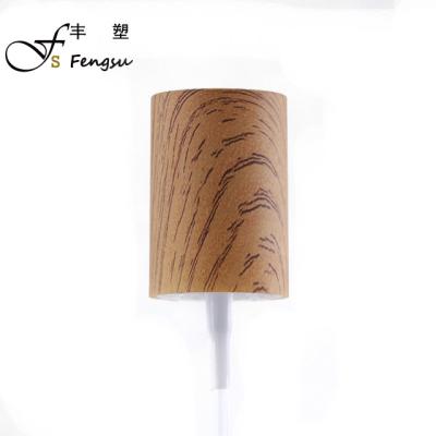 China Non Spill Treatment Pump Plastic Cream Lotion Pump With Bamboo And Wooden Cap for sale