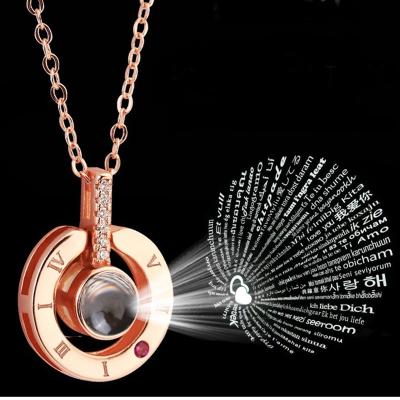 China Rose Gold Plated Crystal Heart Romantic Jewelry Chain Pendant Necklace I Love You From 100 Languages ​​CLASSIC Projection Necklace For Women for sale