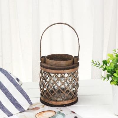 China Environmental Hot Selling High Quality Handmade Wholesale Cylindrical Wicker + Glass Wind Lamp Home Decoration for sale