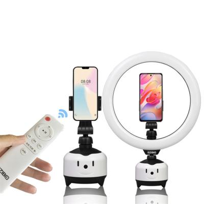 China Mobile Phone Smart Rotation Selfie Stick Auto Pursuit Tripod With Mobile Phone Fill Light Tripod Salon Equipment for sale