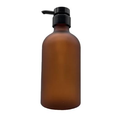 China 500 Ml Frosted Amber Round Single Shoulder PET Bottles Plastic Bottles With Black Pump for sale